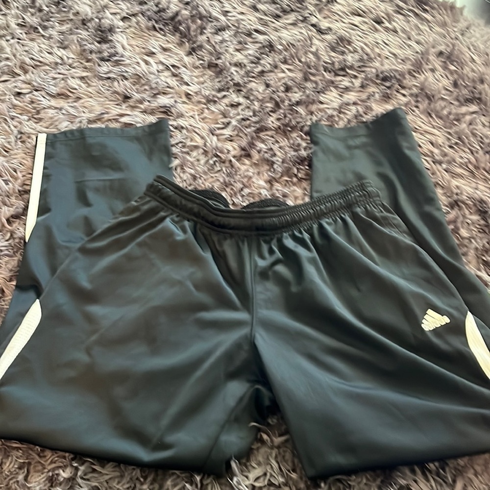 Adidas black with white stripes size Medium joggers in excellent condition.